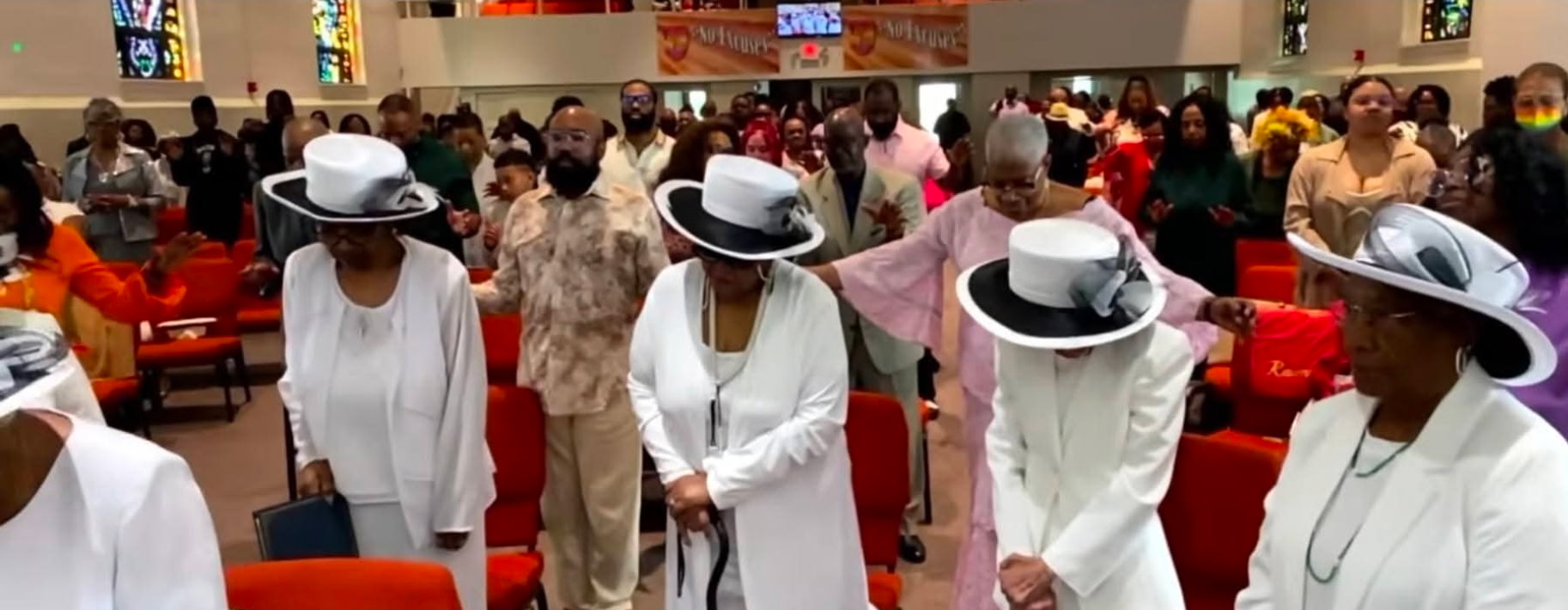 Congregation joined in prayer during Sunday worship
